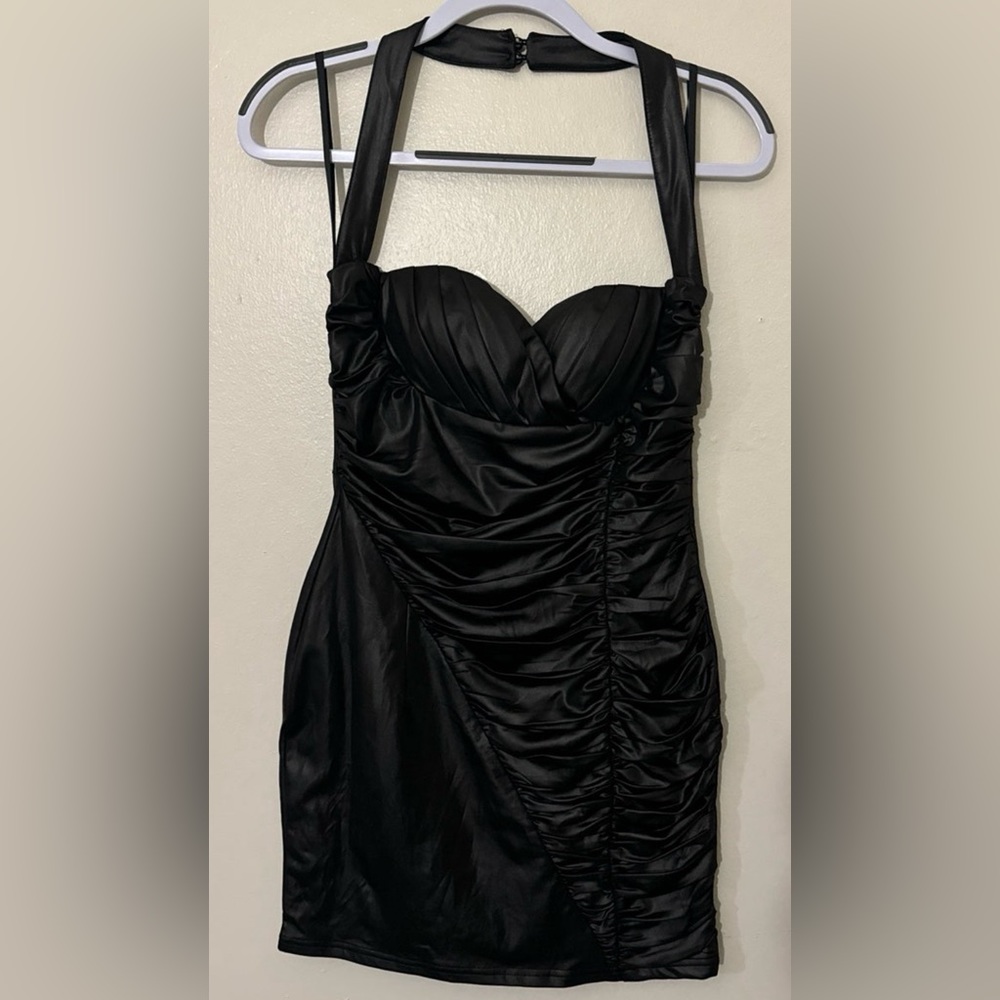 The Sang stretchy leather black dress in the size medium and only used twice.
